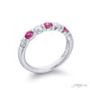 Elegance Elevated: Iconic Single-Row Pink Sapphire and Diamond Band in Pure Platinum